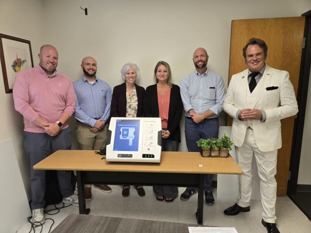 WVVA board member and Admins pictured with Voting machine