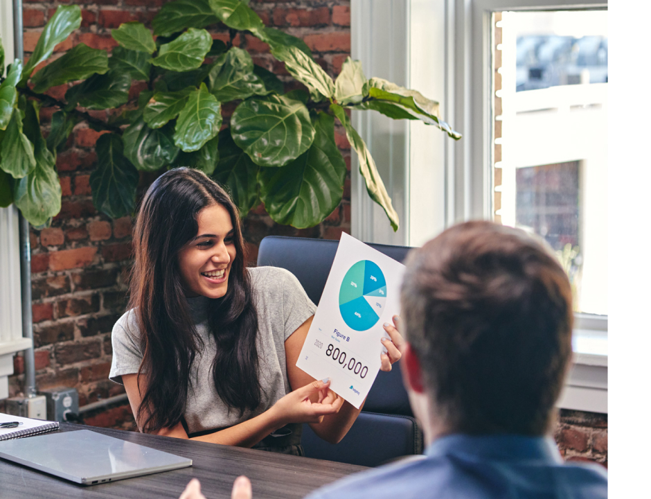 woman showing the graphics to a man