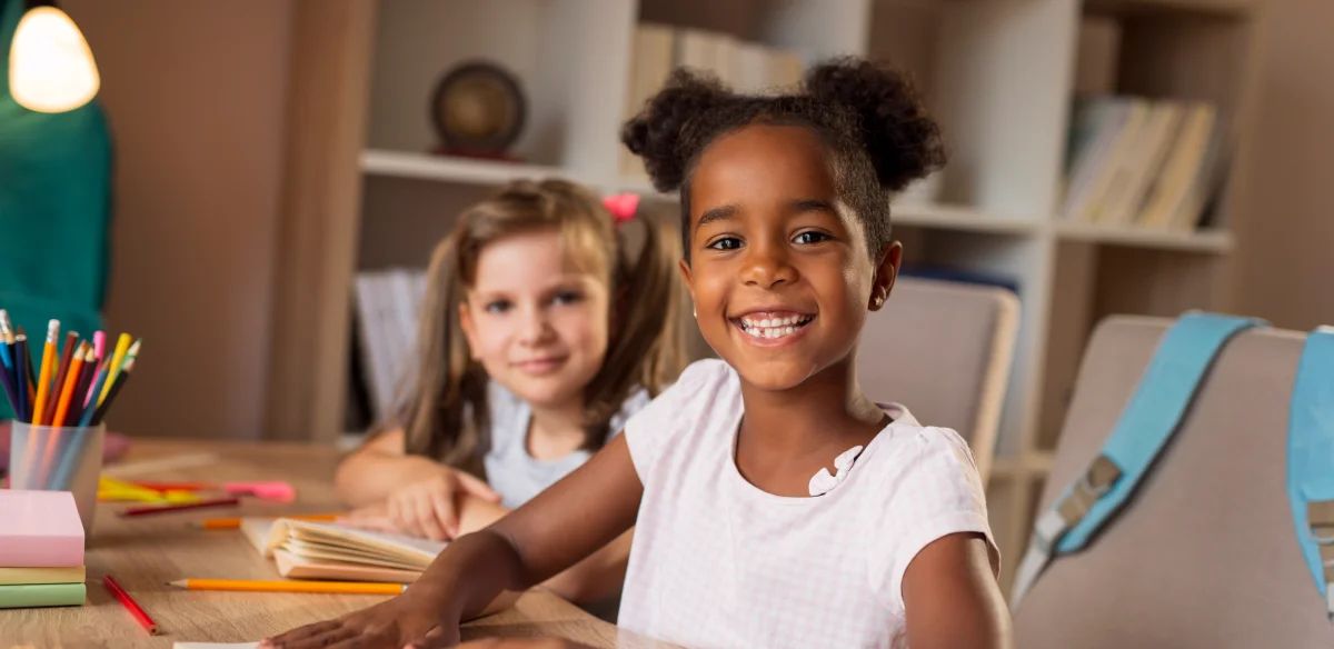 Elementary students doing homework together at home