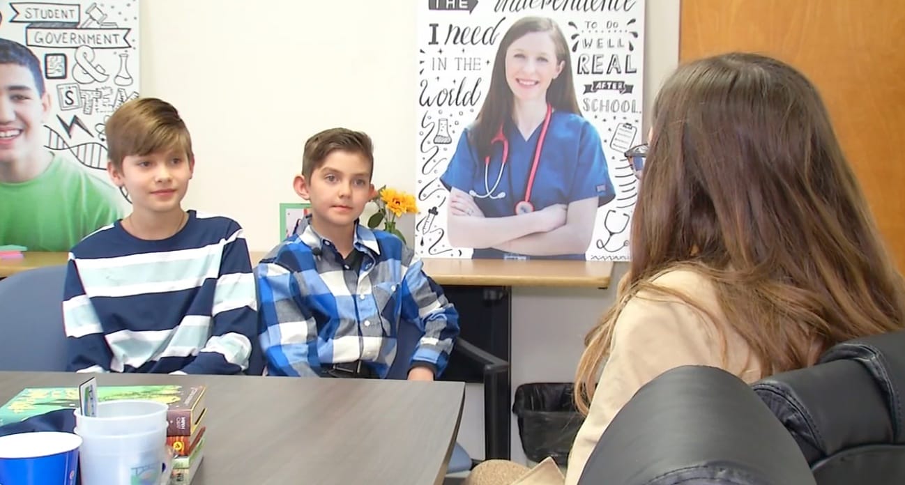 boys talking with teacher