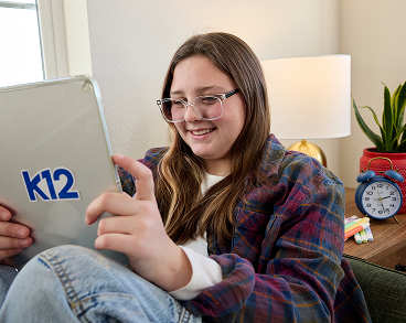 girl smiling with computer