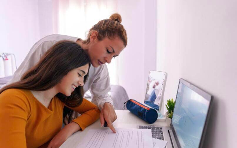 Mom helping student with homework